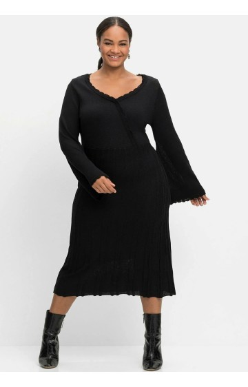 Trikotāžas Sheego kleita ar dziļu V veida izgriezumu Trikotāžas Sheego kleita ar dziļu V veida izgriezumu